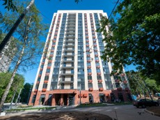 ГП16966576.Машино-место.Фасад здания с выделенными окнами реализуемого объекта.jpg