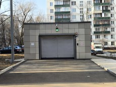 ГП16967059.Машино-место.Фасад здания с выделенными окнами реализуемого объекта.jpg