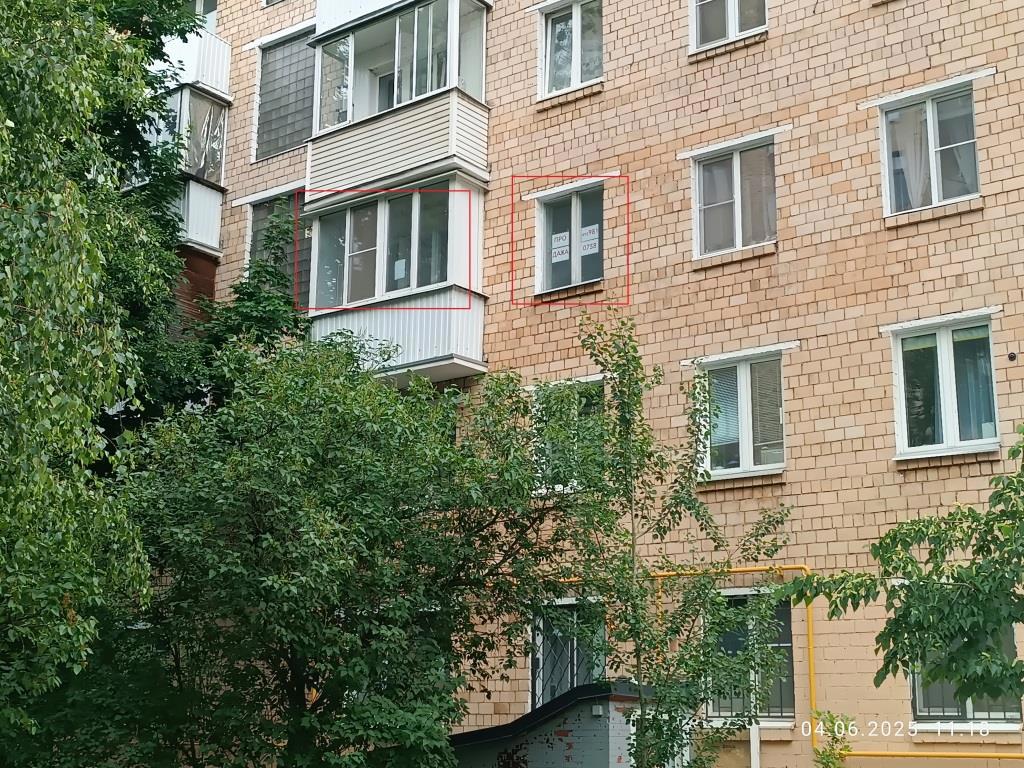 ГП16964100.Квартира.Фасад здания с выделенными окнами реализуемого объекта.jpg