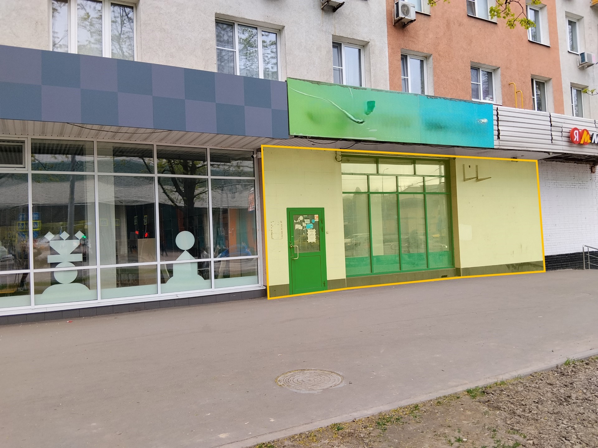 ГП16990339.Нежилое помещение.Фасад здания с выделенными окнами реализуемого объекта.jpg