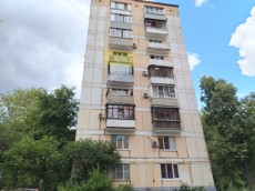 ГП16996600.Квартира.Фасад здания с выделенными окнами реализуемого объекта.jpg